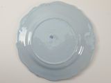 a blue plate with a blue flower on it