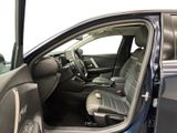 the interior of a car with the door open showing the driver ' s seat