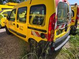 a yellow van that is parked on the side of the road