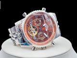 a close up of a watch on display on a stand