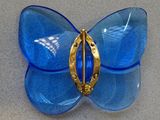 blue glass butterfly brooch with a gold plated clasp