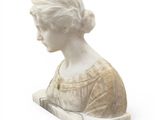 marble bust of a woman with a book in her hand
