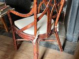 a chair that is sitting in front of a fire place