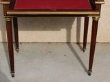 a small table with a red cover on top of it