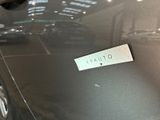 a sticker on the hood of a black car