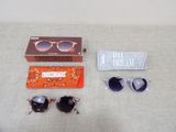 a pair of sunglasses, sunglasses case, and a pair of sunglasses