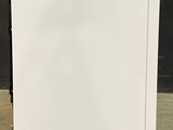 an image of a white refrigerator with a blue sticker on the door