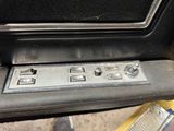 a close up of a car ' s dash panel with buttons