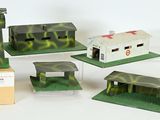 four different models of military buildings on a white surface
