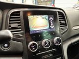the dashboard of a car with a car camera mounted on the dash