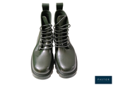 a picture of a pair of green boots on a white background