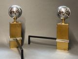 pair of polished steel and brass globe lamps on pedestals