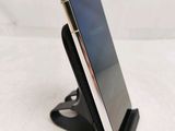 an image of a cell phone is sitting on a stand