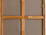 a close up of a wooden frame with a window in the middle
