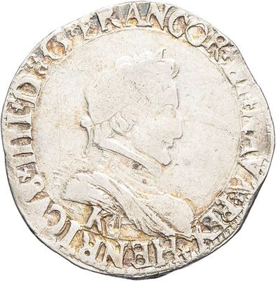 a close up of a coin on a white surface