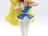 a small figurine of a woman in a blue dress