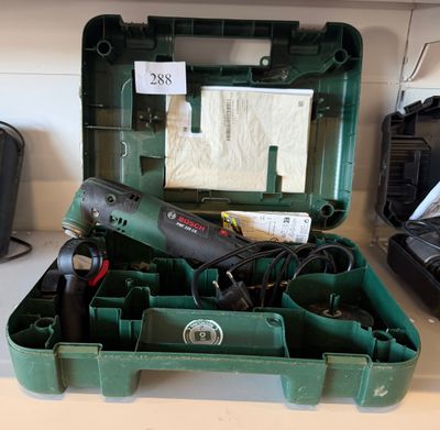 a green tool box with tools in it on a counter
