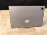 a laptop that is sitting on a wooden table