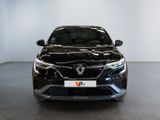 the front view of a black car parked in a showroom