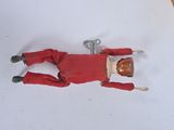 a small doll of a man laying on the floor