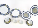a lot of blue and white plates and cups