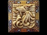 an image of a picture of an octopus on a plaque