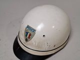 a white helmet that is sitting on a table