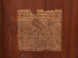 a wooden door with a sign on it that says tea house door