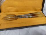 a very old looking pen in a case on a table
