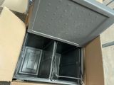 a box that has two metal pans inside of it