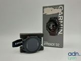the garmin gps watch is next to a box of garmin