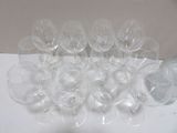 many empty wine glasses sitting on a table