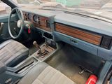 a dashboard of a car with a steering wheel and dashboard controls