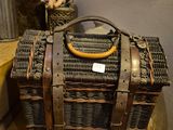 a wicker bag sitting on top of a yellow table