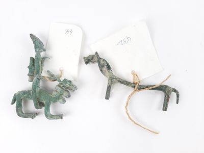 pair of bronze figurines of a horse and a horse with a rider