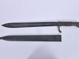 pair of two knives on a white surface with a white background