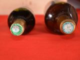 two bottles of wine that are sitting on a table