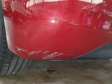 a close up of a red car that has been painted