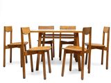 table à manger avec six chaises et un plateau en verre