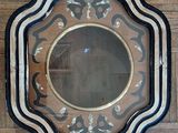 a mirror that is on the wall on the floor