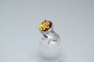 a close up of a ring with a citrine stone in it