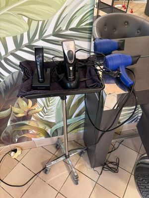 a hair dryer and blow dryer sitting on a table