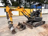 a small excavator that is sitting in the dirt