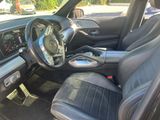 the interior of a car with black leather seats and a steering wheel