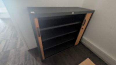 an image of a book shelf in a room