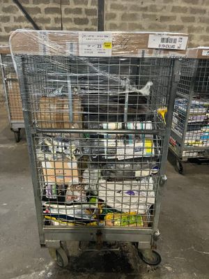 a metal cart with food in it in a warehouse