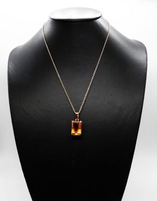 a close up of a necklace on a mannequin mannequin