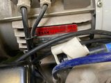 a close up of a motor with wires and wires attached to it