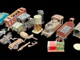 a lot of toy trains and cars on a black background