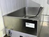 stainless steel counter top with a hot plate on top of it